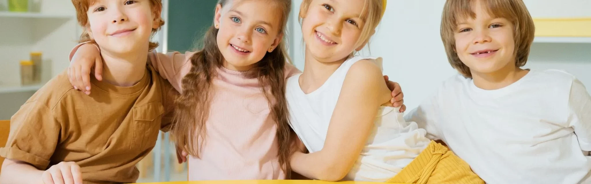 four_small_kids_at_the_yellow_table-2880w