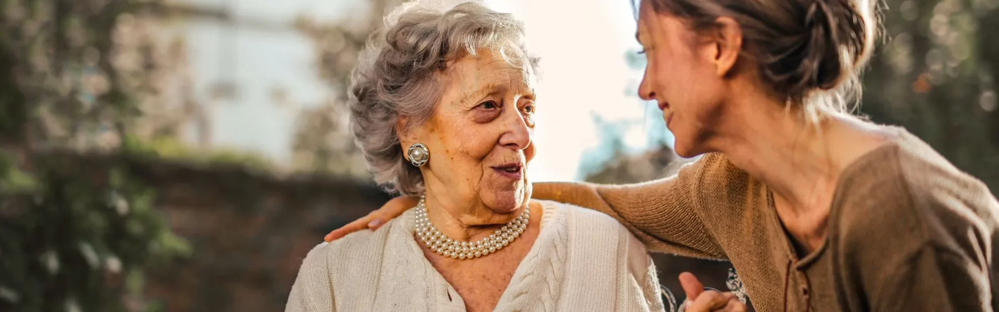 smiling_woman_care_about_another_woman-2880w